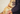 Dog being hold by a man - Our Giving Initiative, Dr. Dobias Healing Solutions