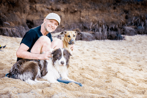 Peter Dobias with Pax on the beach