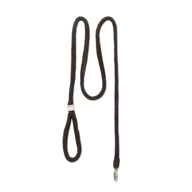 A brown leather leash with an adjustable buckle